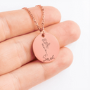 Rose gold: close-up of the round pendant engraved with a rose and the name Sarah