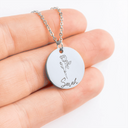 Silver: close-up of the round pendant engraved with a rose and the name Sarah